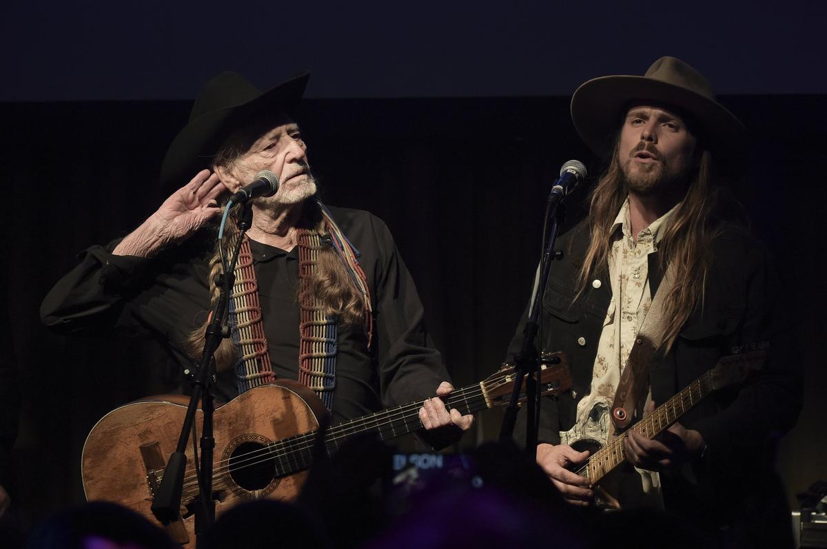 Willie Nelson, left, and Lukas Nelson will perform at the Outlaw Music Festival Sept. 15, at the Coastal Credit Union Music Park at Walnut Creek in Raleigh. Lukas Nelson will bring his band, Promise of the Real. Bonnie Raitt and Alison Krauss also are on the lineup.