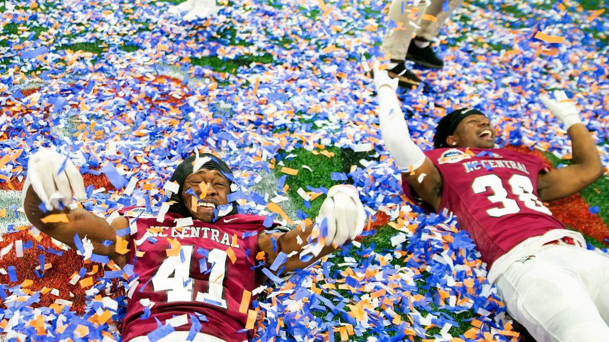 North Carolina Central linebacker Isaiah Lawson (41) and defensive back Malcolm Reed celebrate after the Celebration Bowl NCAA college football game against Jackson State, Saturday, Dec. 17, 2022, in Atlanta. (AP Photo/Hakim Wright Sr. )