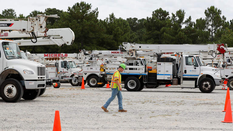 They’ve come hundreds of miles to help get the power back on after Hurricane Dorian