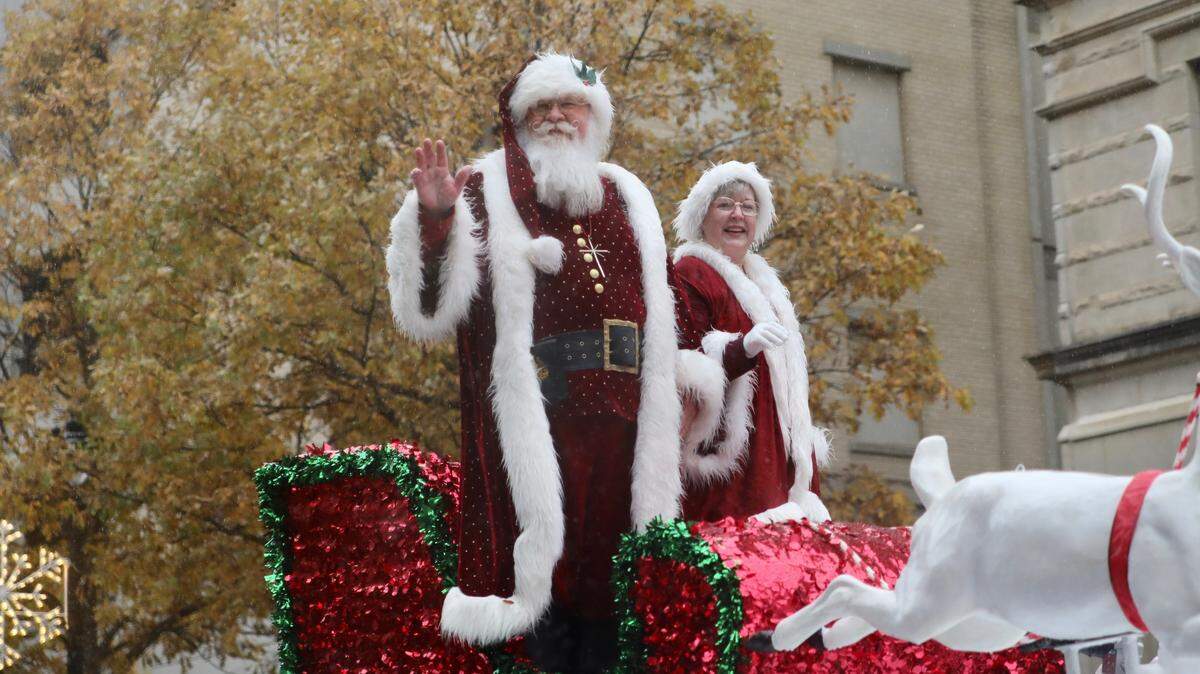 Santa Claus and Mrs. Claus wave to the crowd during the Raleigh Christmas Parade in Raleigh, N.C. on November 23, 2019. This year’s parade is an all virtual affair.
