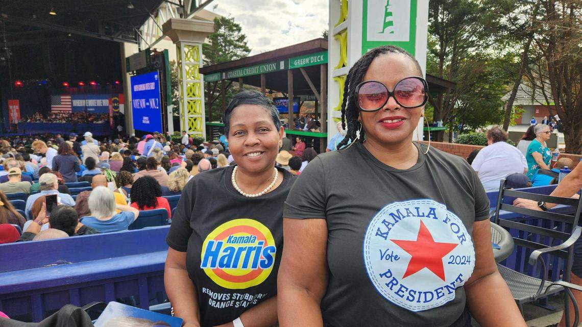 Toby Bullock, left, and Syeeda Rose, right, who attended their first Kamala Harris campaign rally at Coastal Credit Union Music Park at Walnut Crrek in Raleigh on Wednesday, Oct. 30, 2024.