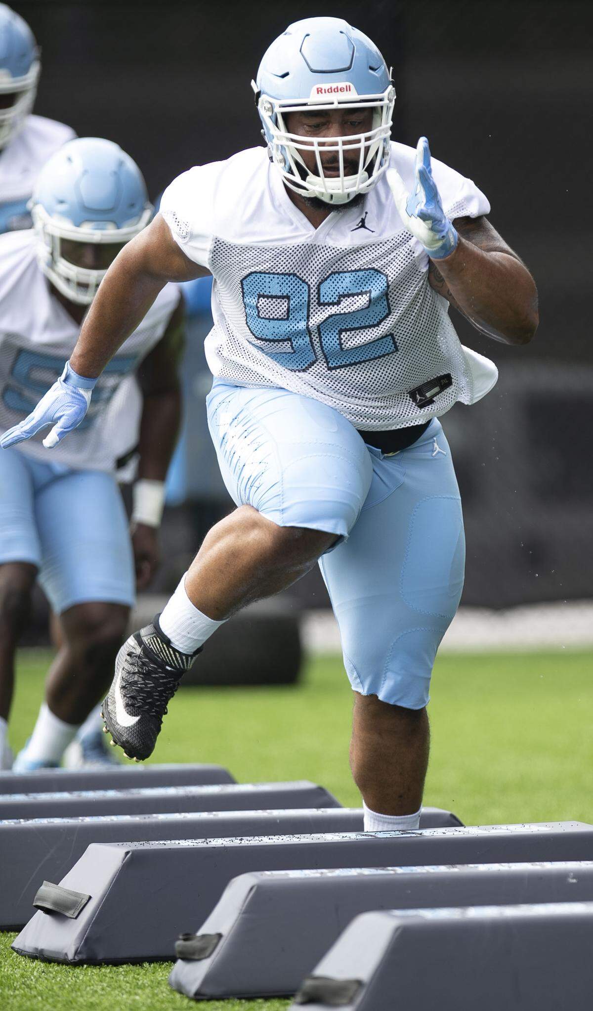 North Carolina defensive lineman Aaron Crawford (92) runs through a drill during the Tar Heels’ first practice of the season on Friday, August 2, 2019 at the Football Practice Complex in Chapel Hill, N.C.
