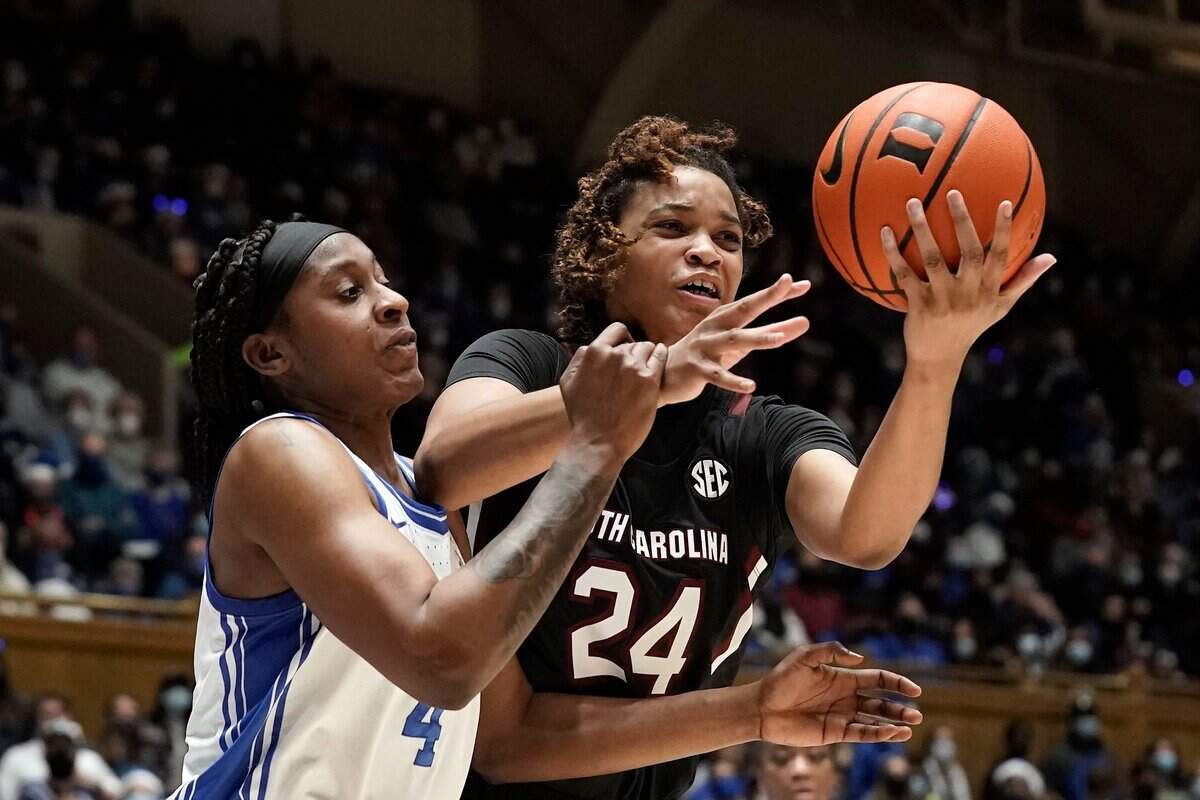Duke guard Elizabeth Balogun (4) and South Carolina guard LeLe Grissett (24) reach for a rebound during the first half of an NCAA college basketball game in Durham, N.C., Wednesday, Dec. 15, 2021. (AP Photo/Gerry Broome)