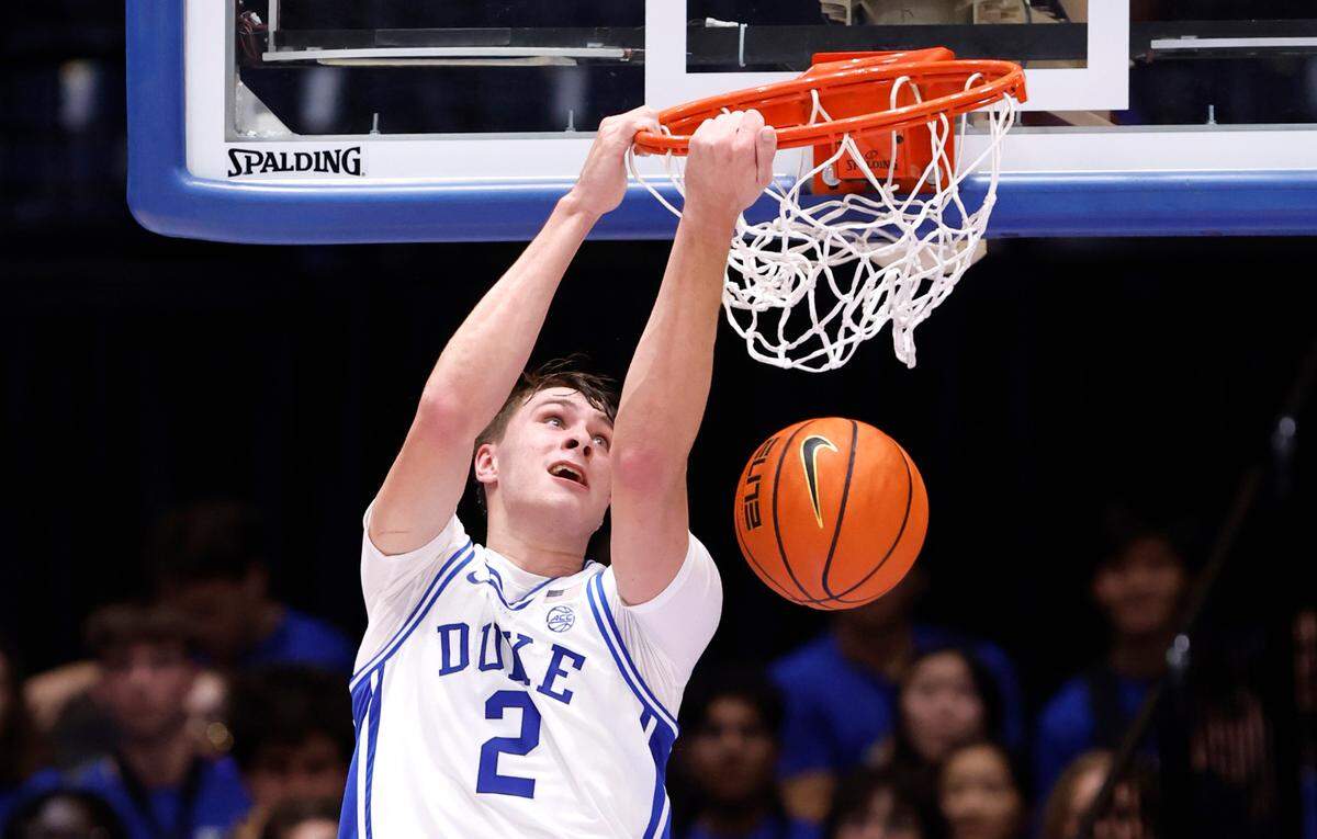 Duke’s Cooper Flagg (2) slams in two during a scrimmage during the Blue Devils’ Countdown to Craziness at Cameron Indoor Stadium in Durham, N.C., Friday, Oct. 4, 2024.
