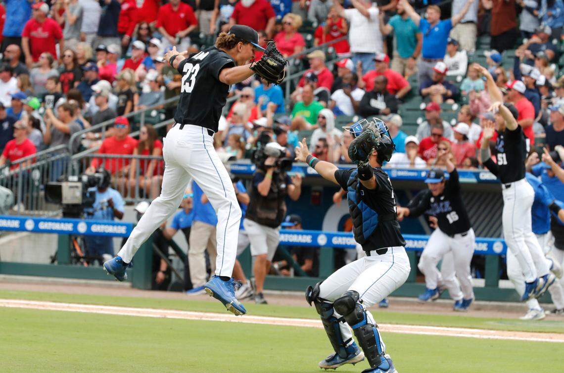 Duke’s Marcus Johnson (23) jumps into the arms of Duke’s Michael Rothenberg (38) after Duke’s 1-0 victory over N.C. State to win the ACC Baseball Championship at Truist Field in Charlotte, N.C., Sunday, May 30, 2021.