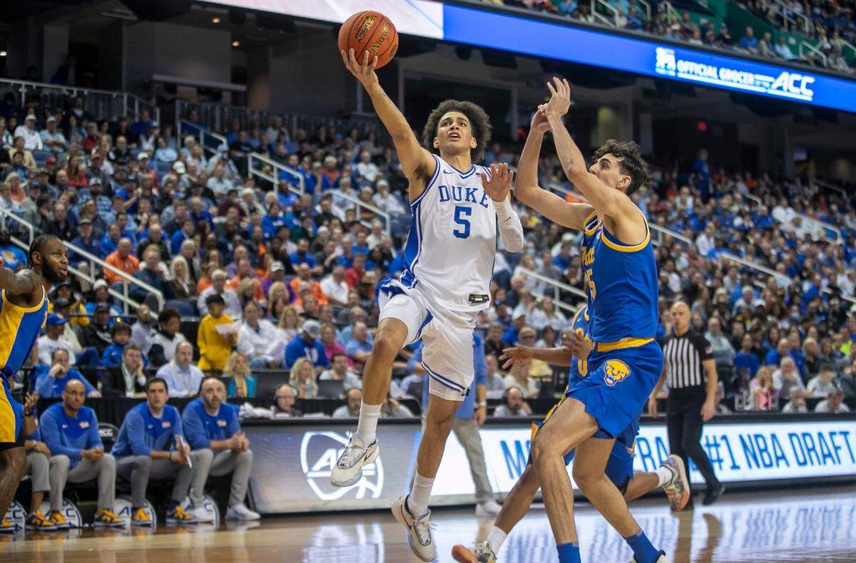Duke’s Tyrese Proctor (5) drives to the basket in the first half against Pittsburgh’s Guillermo Diaz Graham (25) during the third round of the ACC Tournament on Thursday, March 9, 2023 at the Greensboro Coliseum in Greensboro, N.C.