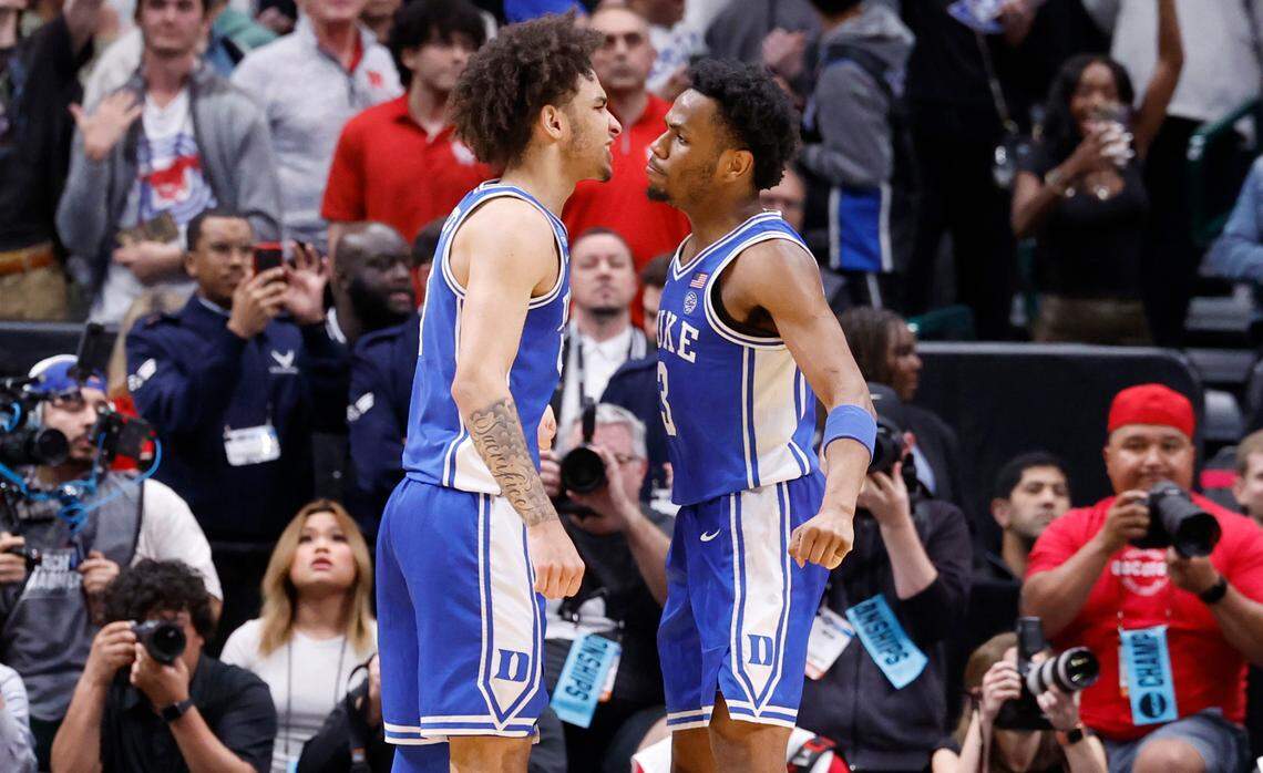 Duke’s Tyrese Proctor (5) and Jeremy Roach (3) celebrate late in the second half of Duke’s 54-51 victory over Houston in their NCAA Tournament Sweet 16 game at the American Airlines Center in Dallas, Texas, Friday, March 29, 2024.