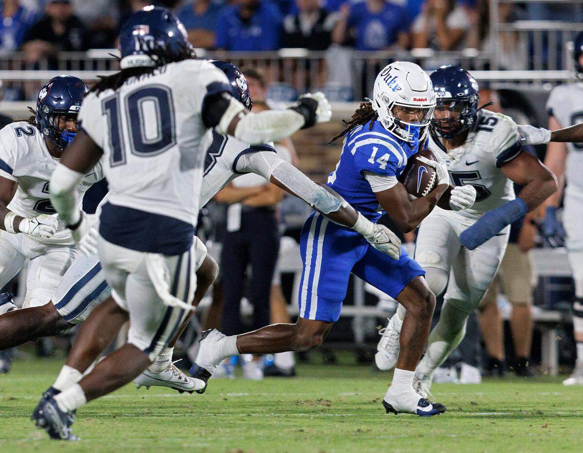 Duke’s Que’Sean Brown runs the ball during the second half of the Blue Devils’ 26-21 win over UConn on Saturday, Sept. 14, 2024, at Wallace Wade Stadium in Durham, N.C.