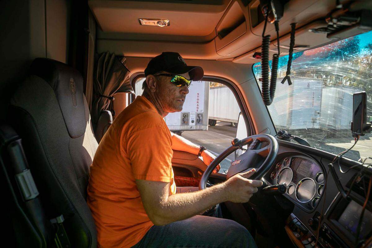 C&L Transport driver John McDevitt moves a trailer loaded with bread at the Automatic Rolls of North Carolina bakery on November 11, 2021 in Clayton, N.C. The trailer was parked for another driver to pick up to make delivery.