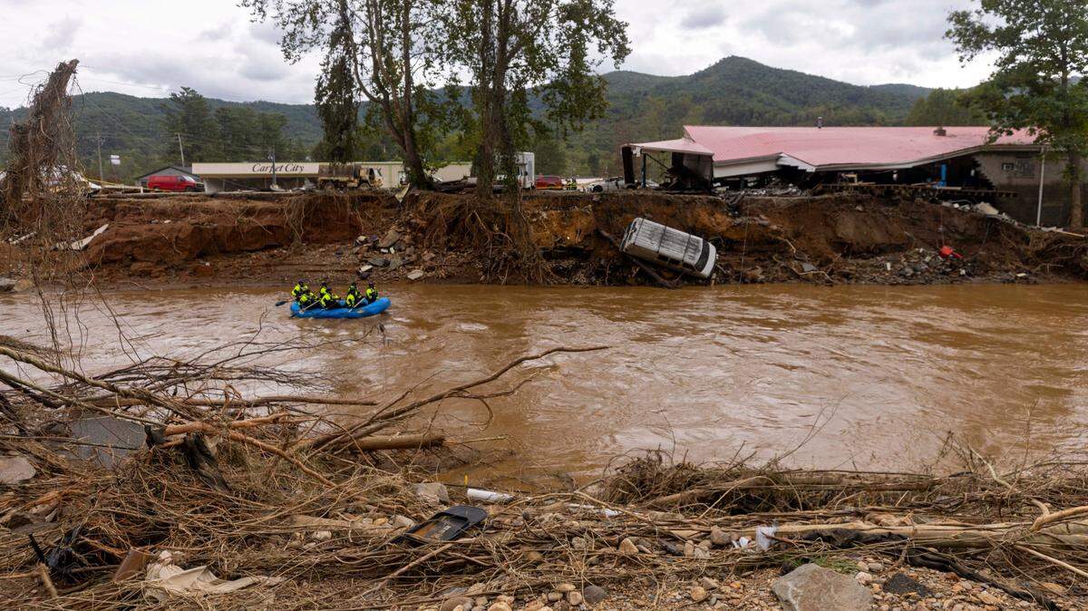 A rescue team paddles down the Swannanoa River on Sunday, Sept. 29, 2024. The remnants of Hurricane Helene caused widespread flooding, downed trees, and power outages in western North Carolina.