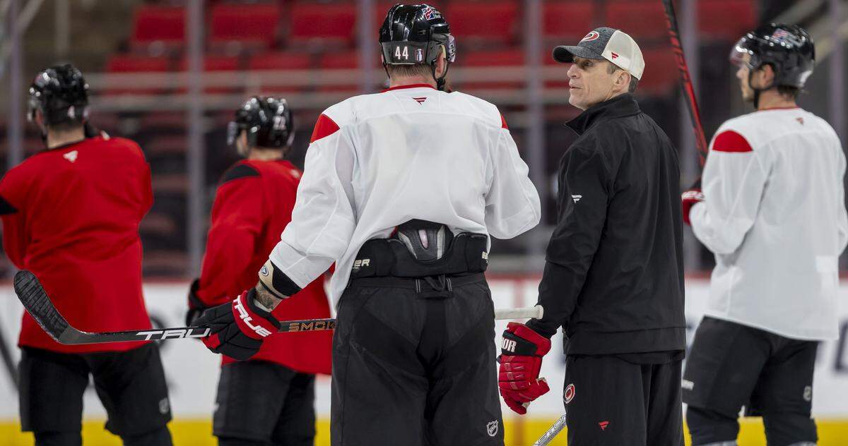 Carolina Hurricanes coach Rod Brind’Amour talks with left wing Nicolas Deslauriers (44) during practice on Friday, May 15, 2026 at Lenovo Center in Raleigh, N.C.