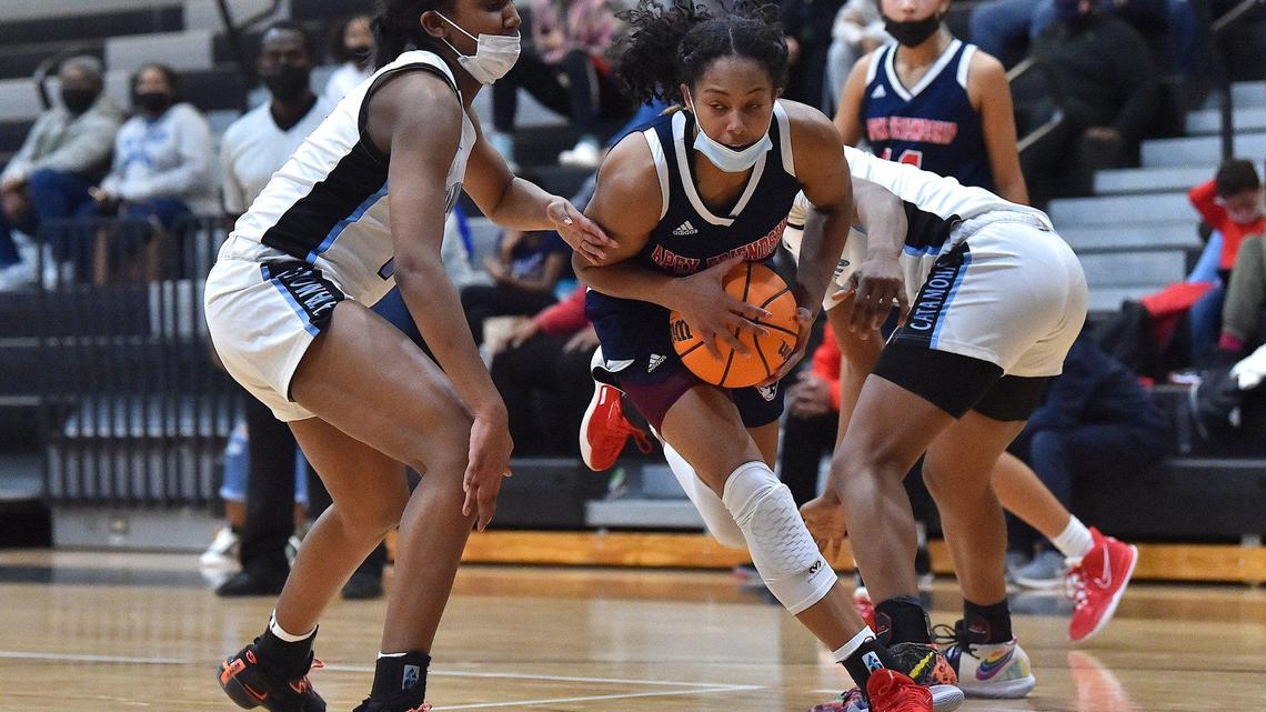 Apex Friendship’s Indya Nivar (12) drives against Panther Creek’s Madisyn Jordan (14) during the second half. The Panther Creek Catamounts and the Apex Friendship Patriots met in a conference basketball game in Cary, NC on January 28, 2022.
