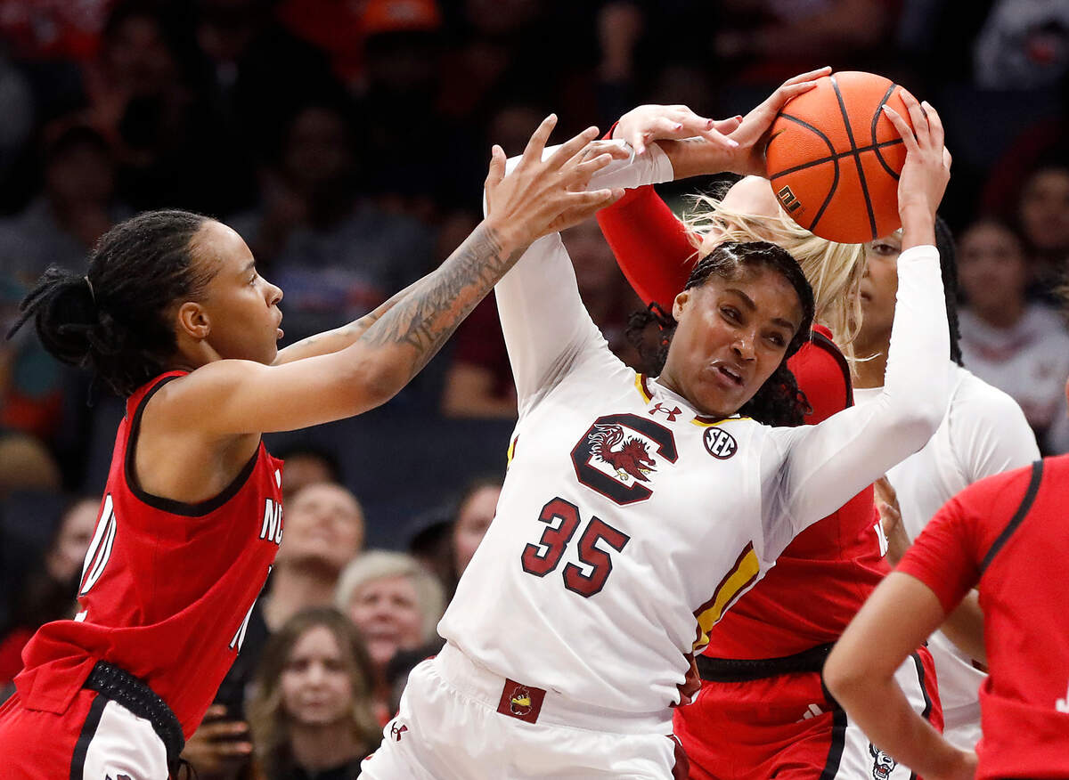 N.C. State’s Aziaha James and Lizzy Williamson pressure South Carolina’s Sakima Walker during the first half of the Wolfpack’s 71-57 loss on Sunday, Nov. 10, 2024, at Spectrum Center in Charlotte, N.C.