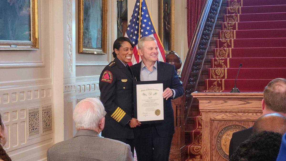Outgoing Raleigh Police Chief Estella Patterson, left, poses for photos with N.C. Gov. Josh Stein after a ceremony inducting her into the Order of the Long Leaf Pine at the Executive Mansion on Feb. 18, 2025 in Raleigh.