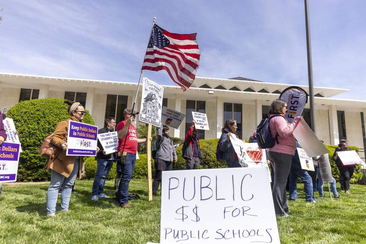 About 50 demonstrators organized by the North Carolina Association of Educators, Public Schools First NC and the North Carolina PTA protest outside the North Carolina Legislative Building on Wednesday, April 8, 2026, during the “wEDnesday for Public Schools” protest over the legislature’s failure to pass a state budget and the North Carolina Supreme Court’s decision to dismiss the long-running Leandro school funding lawsuit and overturn a 2022 court ruling directing the transfer of funds to public schools.