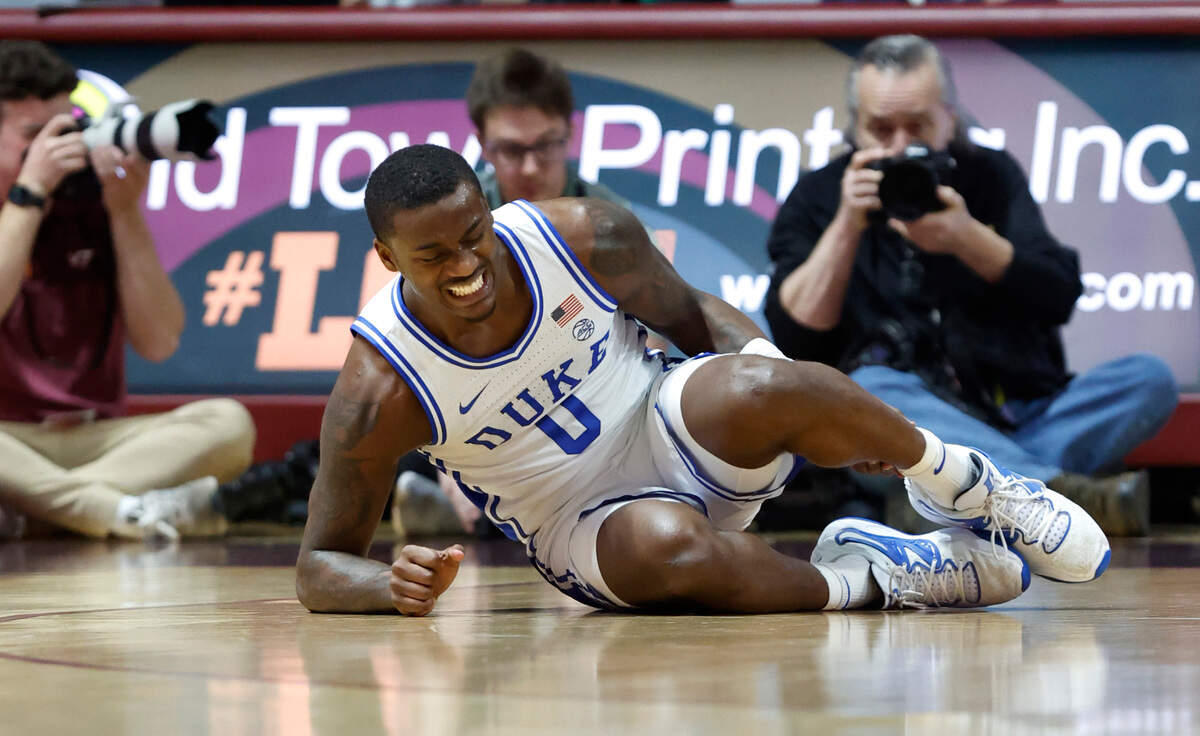 Duke’s Dariq Whitehead (0) winces in pain after being injured during the second half of Duke’s game against Virginia Tech at Cassell Coliseum in Blacksburg, VA., Monday, Jan. 23, 2023.