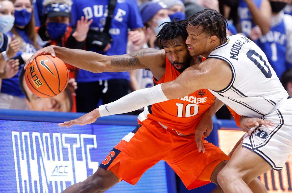 Duke’s Wendell Moore Jr. (0) pressures Syracuse’s Symir Torrence (10) during the second half of Duke’s 79-59 victory over Syracuse at Cameron Indoor Stadium in Durham, N.C., Saturday, Jan. 22, 2022.