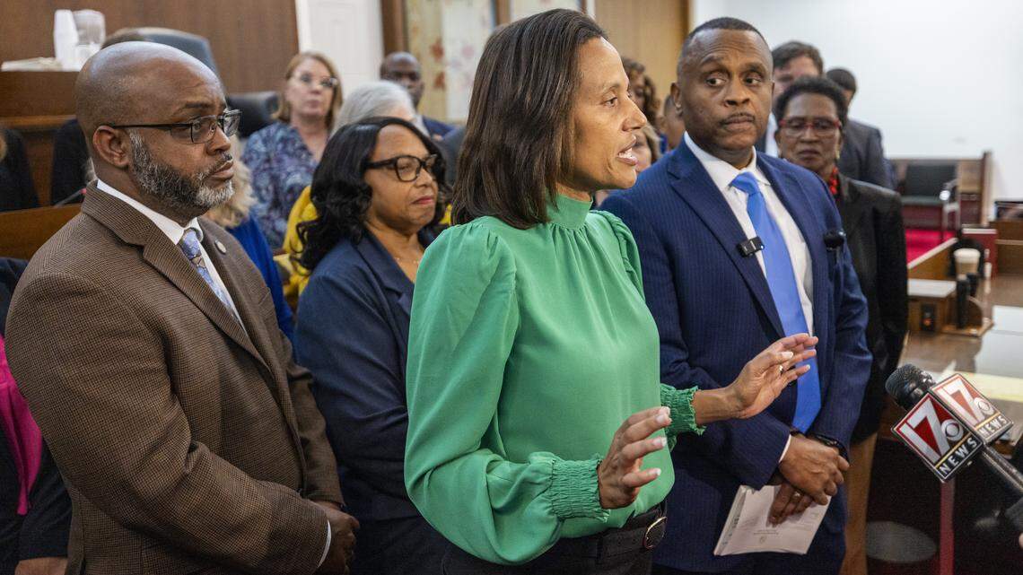 North Carolina Senate Minority Leader Sydney Batch, center, and House Minority Leader Robert Reives, right, lead a news conference with other Democratic House and Senate members on the House floor on Monday, Nov. 17, 2025 at the North Carolina Legislative Building in Raleigh.