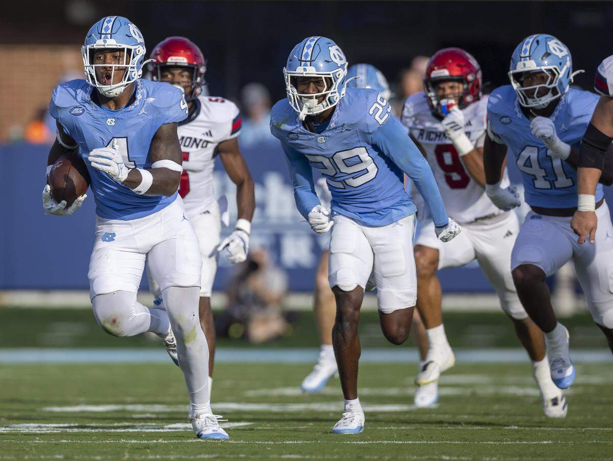 North Carolina Mikia Gbayor (4) returns a Richmond fumble 62-yards for a touchdown to give the Tar Heels’ a 34-3 lead in the fourth quarter against Richmond on Saturday, September 13, 2025 at Kenan Stadium in Chapel Hill, N.C.