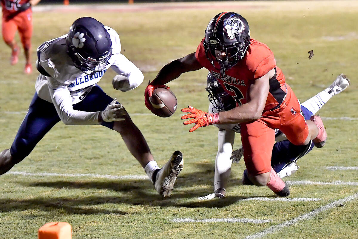 Rolesville running back Amir Brown (2) dives for the goal line against Millbrook’s Cairo Williams (17) and Rashad Streets (22) during the second half. The Rolesville Rams and the Millbrook Wildcats met in a football game in Raleigh. N.C. on October 11, 2024.