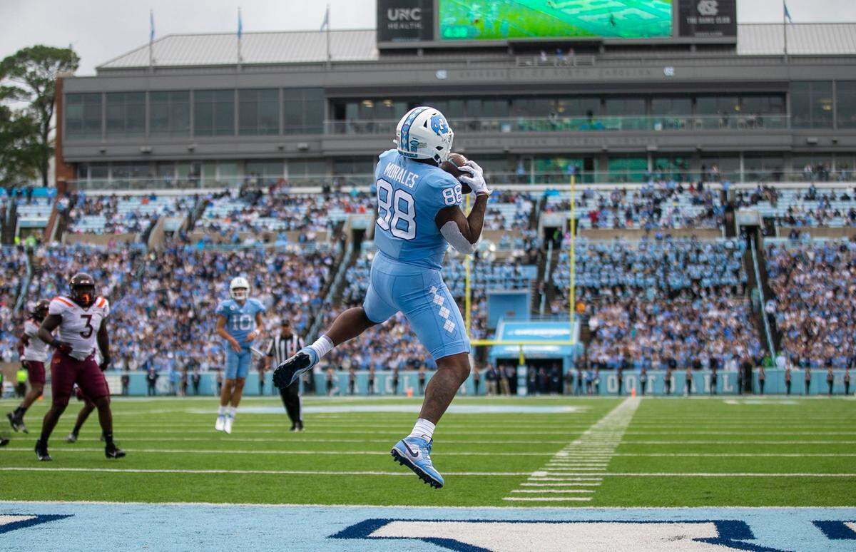 North Carolina’s Kamari Morales (88) scores on a three-yard reception from quarterback Drake Maye (10) to give the Tar Heels’ a 7-3 lead over Virginia Tech on Saturday, October 1, 2022 at Kenan Stadium in Chapel Hill, N.C.