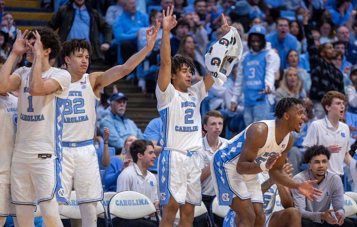 North Carolina’s Elliot Cadeau (2) and his teammates react after a three-point basket by R.J. Davis (4) in the second half against Charleston Southern on Friday, December 29, 2023 at the Smith Center in Chapel Hill, N.C.