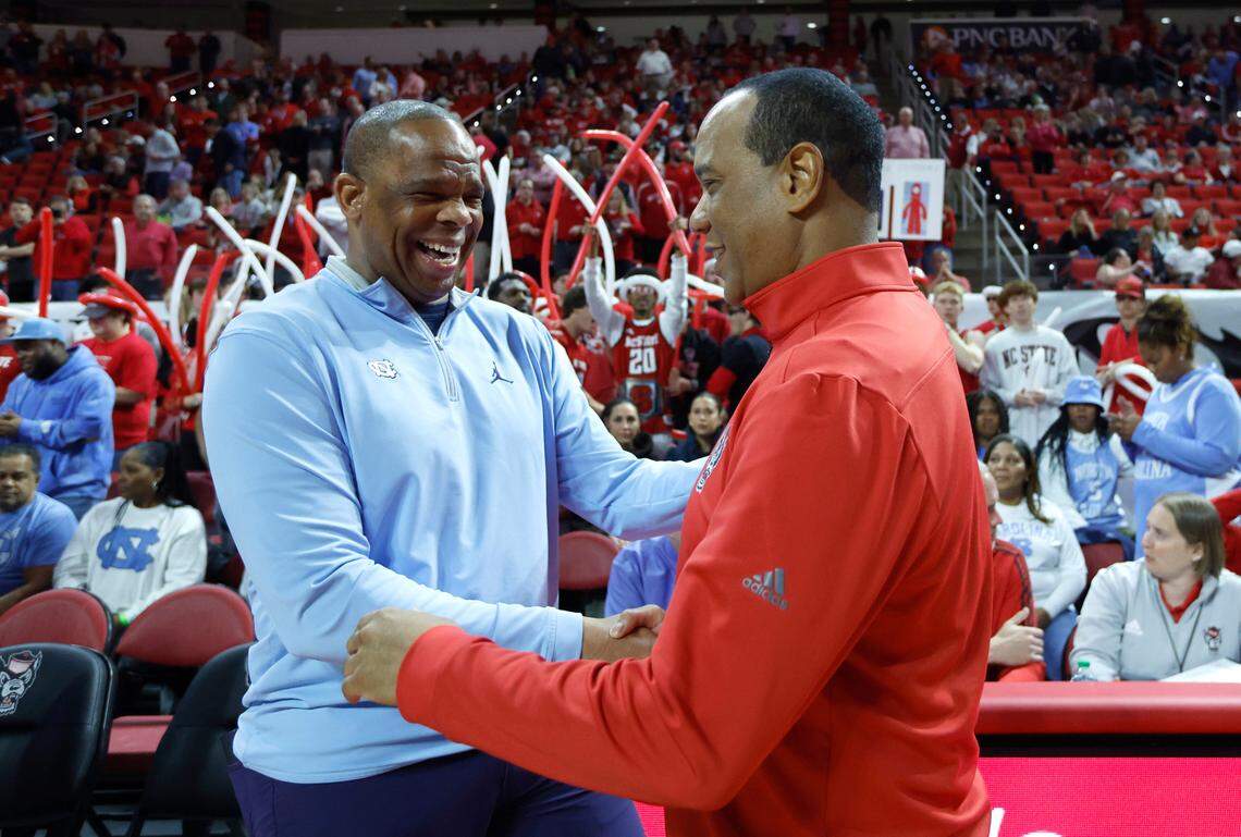 North Carolina head coach Hubert Davis greets N.C. State head coach Kevin Keatts before N.C. State’s game against UNC at PNC Arena in Raleigh, N.C., Sunday, Feb. 19, 2023.