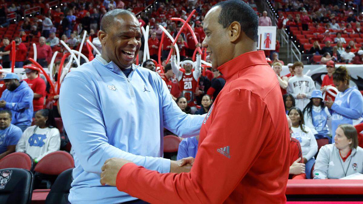 North Carolina head coach Hubert Davis greets N.C. State head coach Kevin Keatts before N.C. State’s game against UNC at PNC Arena in Raleigh, N.C., Sunday, Feb. 19, 2023.
