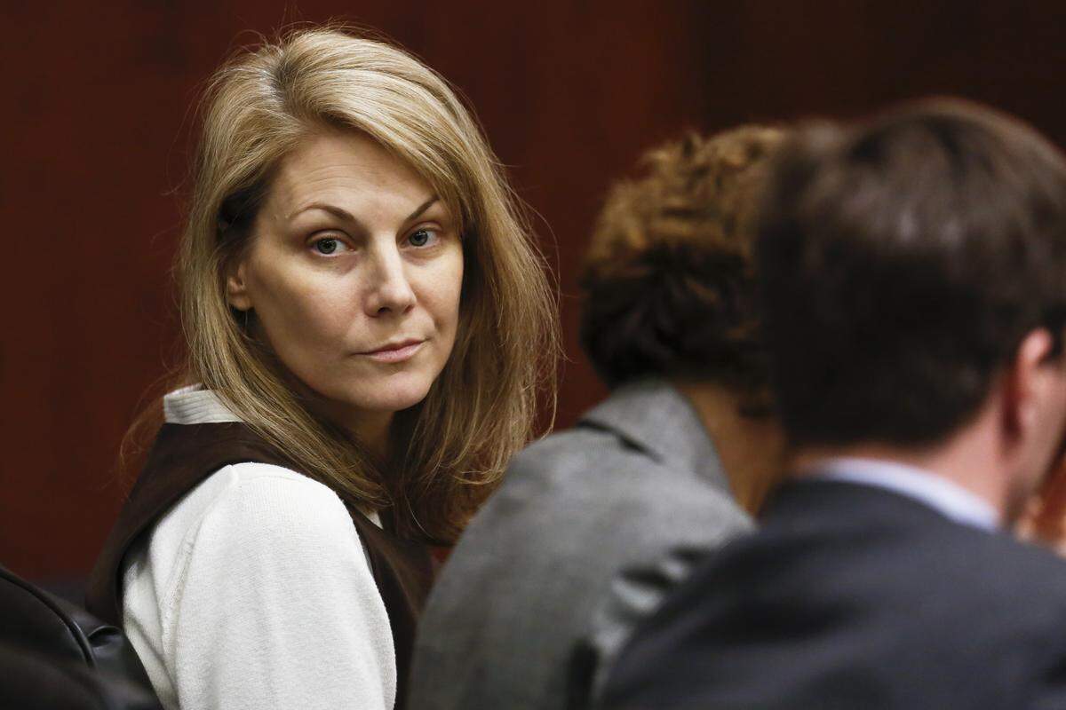 Amanda Hayes, 41, looks toward the courtroom gallery Tuesday, February 18, 2014, after a weeks-long murder trial in the Wake County Justice Center. Hayes is accused of acting in concert with her husband Grant Hayes, 34, to murder Laura Jean Ackerson, 27, the mother of Grant Hayes’ two sons, in July 2011 and dismembering and disposing her body in a Texas creek.