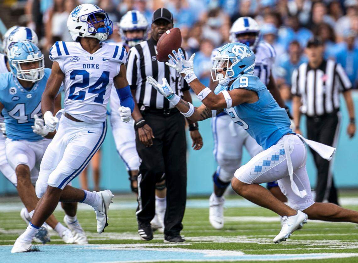North Carolina’s Cam’Ron Kelly (9) intercepts a pass by Duke quarterback Gunnar Holmberg (12) in the third quarter on Saturday, October 2, 2021 at Kenan Stadium in Chapel Hill, N.C.