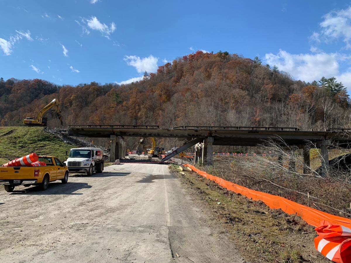 The old Interstate 40 bridge over Harmon Den Road and Cold Springs Creek, right, before it was demolished in November 2021. The new bridge will include a wider opening and trails along the creek to encourage wildlife to cross under the highway.