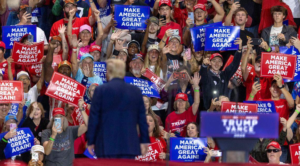 Former President Donald Trump, Republican presidential nominee, soaks up applause from supporters behind the dais following his remarks on Wednesday, October 30, 2024 at the Rocky Mount Event Center in Rocky Mount, N.C.