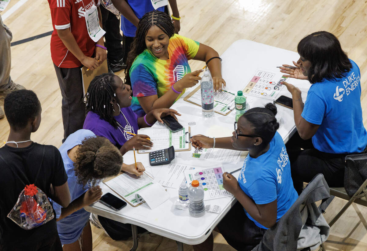 Volunteers staffed tables where students made decisions about spending, and during the “Tracks” portion, they spoke with teens about potential career paths.