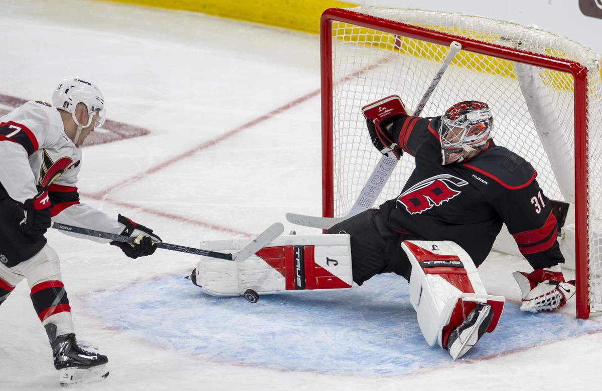 Carolina Hurricanes goalie Frederik Andersen (31) stops a scoring attempt by Ottawa left wing Brady Tkachuk (7) in the third period on Saturday, April 18, 2026 during the first round of the Stanley Cup Playoffs at Lenovo Center in Raleigh, N.C.