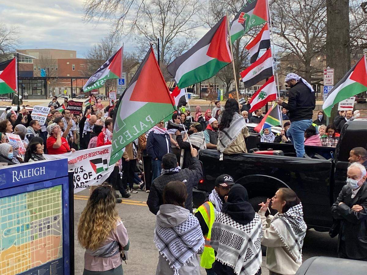 Protesters demanding a ceasefire in the Israel-Hamas war block traffic near Moore Square in downtown Raleigh, North Carolina, on Jan. 28, 2024.