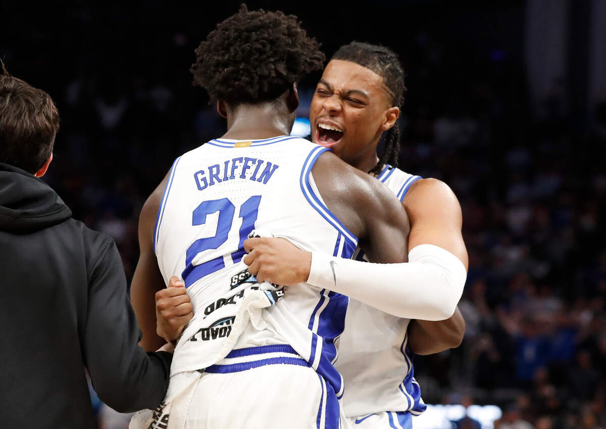 Duke’s Trevor Keels (1) celebrates with AJ Griffin (21) as time runs out in Duke’s 78-69 victory over Arkansas in the NCAA Tournament West Regional finals at the Chase Center in San Francisco, Calif., Saturday, March 26, 2022.