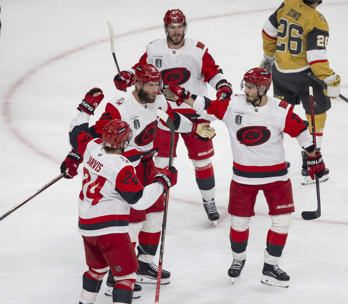 Carolina Hurricanes center Jordan Staal (11) is congratulated by teammates Seth Jarvis (24), Andrei Svechnikov (37) and Sebastian Aho (20) after scoring on Vegas goalie Carter Hart (79) to take a 3-0 lead in the first period in Game 4 of the Stanley Cup Final against Vegas, on Tuesday, June 9, 2026 in Las Vegas, NV.
