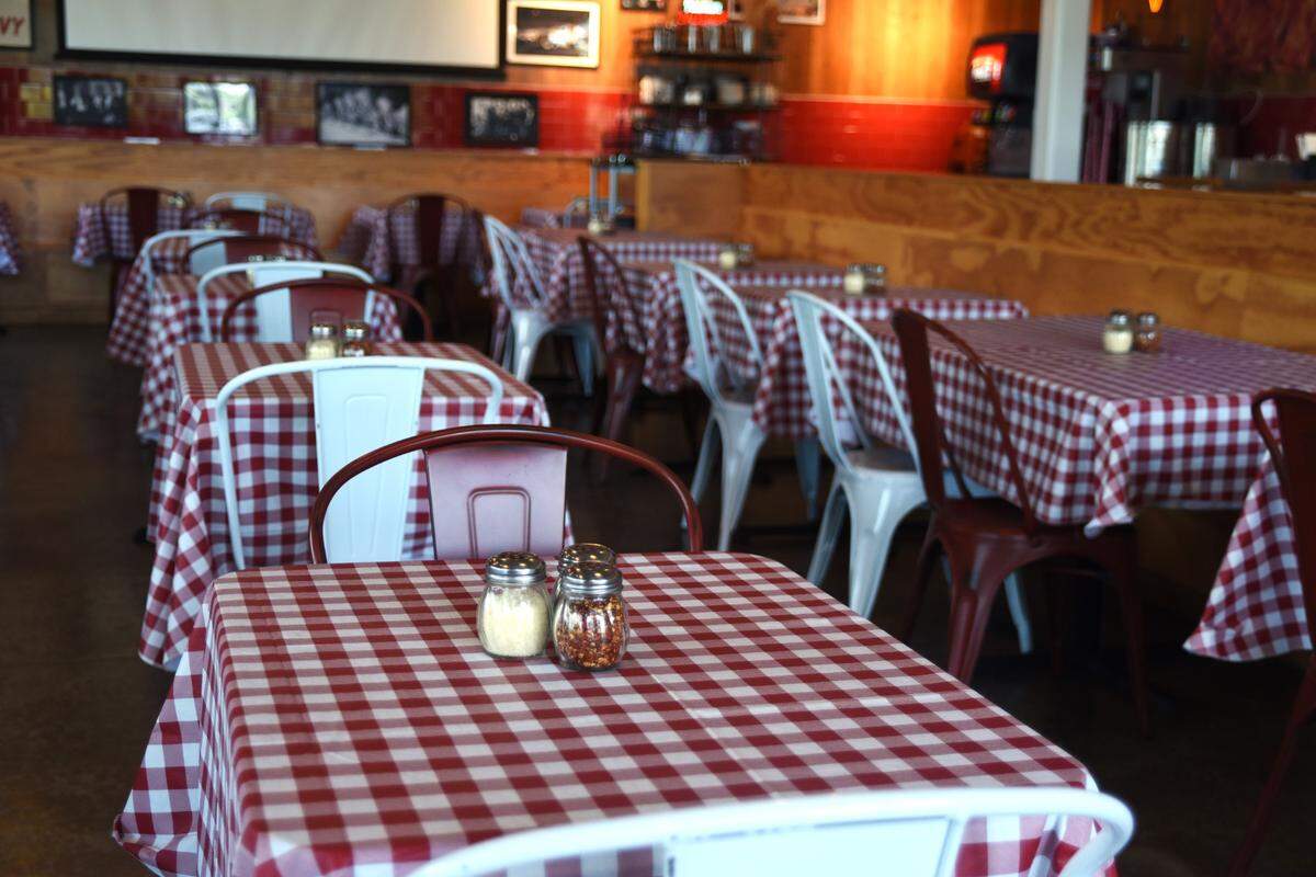 As any respectful red sauce joint would, every table has shakers of parmesan, red pepper flakes and oregano.