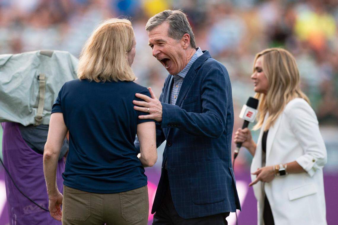 Gov. Roy Cooper smiles after the coin toss during the Manchester City vs Celtic FC game at UNC’s Kenan Stadium on Tuesday, July 23, 2024. Celtic FC won 4-3.