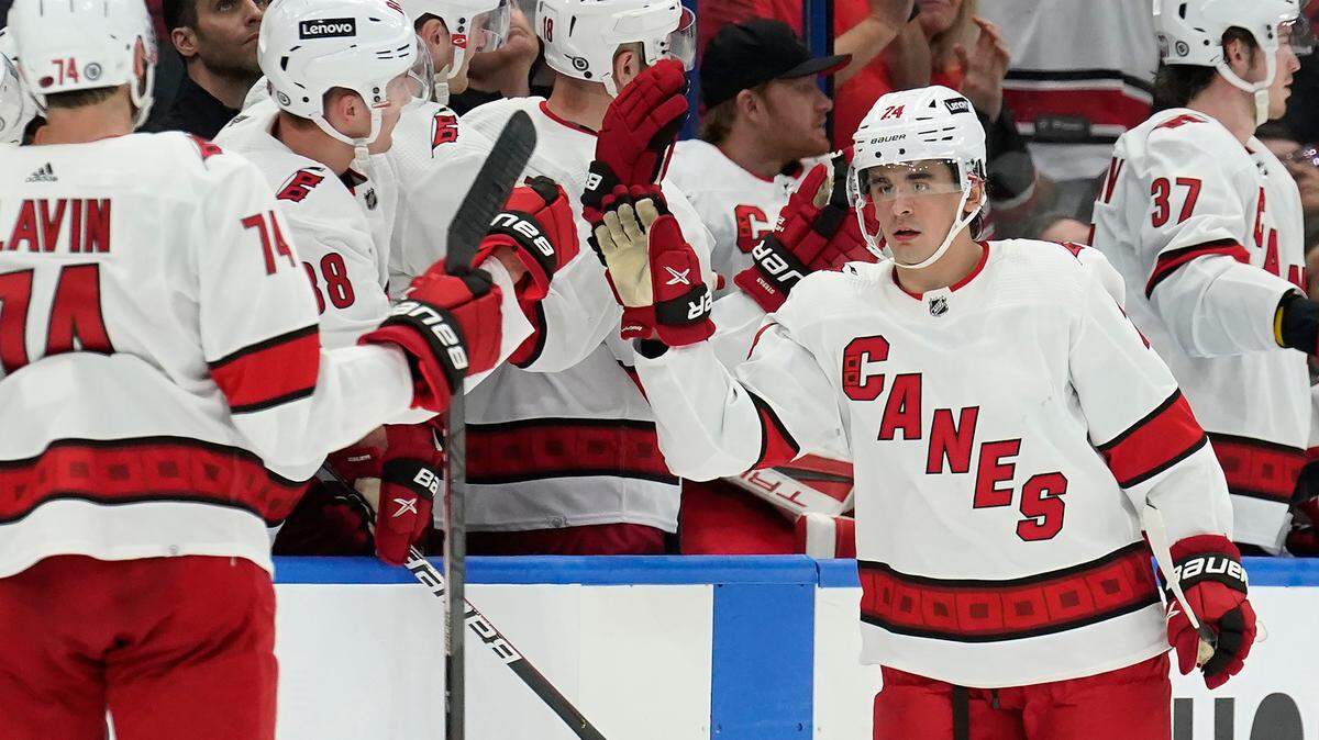 Carolina Hurricanes center Seth Jarvis (24) celebrates with the bench after scoring against the Tampa Bay Lightning during the second period of an NHL hockey game Tuesday, March 29, 2022, in Tampa, Fla. (AP Photo/Chris O’Meara)