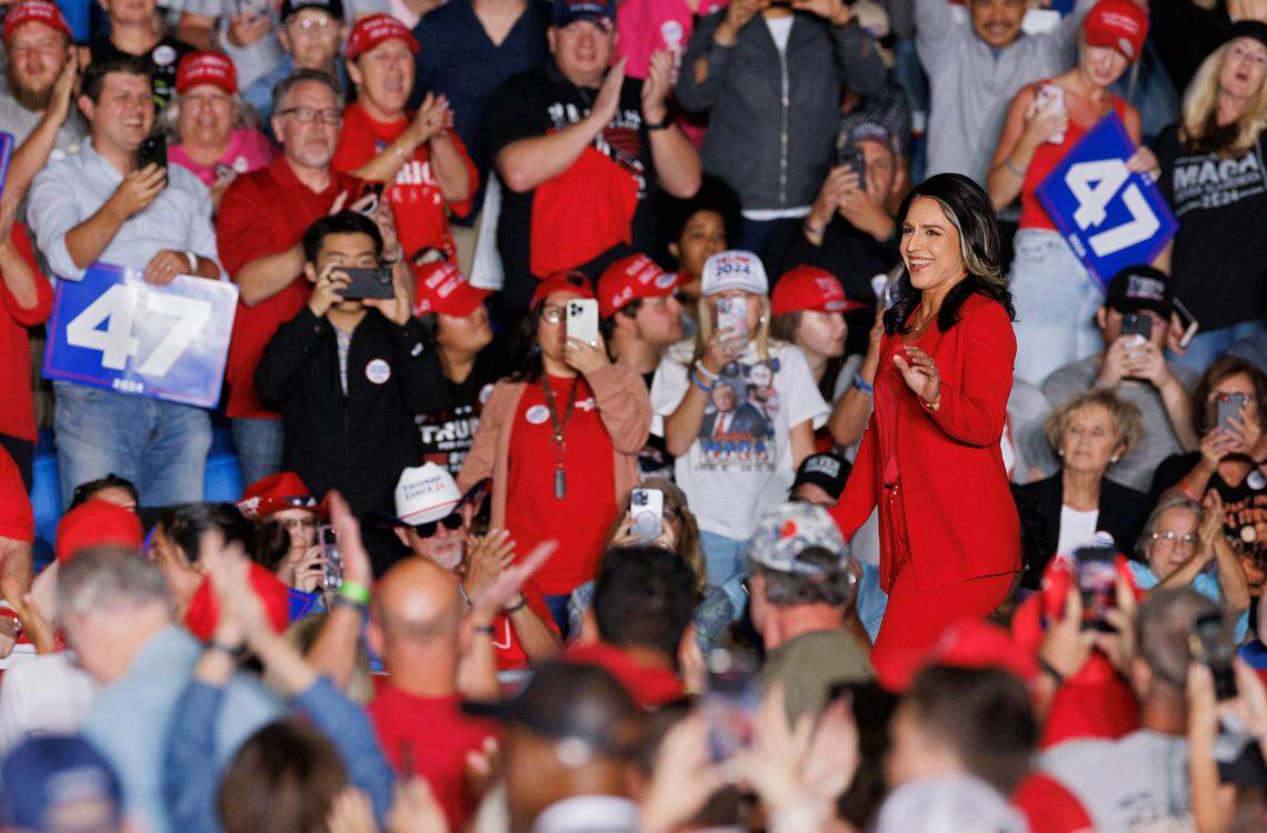 Tulsi Gabbard, a former Democratic congresswoman from Hawaii, waves to the crowd as she is introduced during a rally in support of former President Donald Trump at the Greensboro Coliseum Complex on Tuesday, Oct. 22, 2024, in Greensboro, N.C. Gabbard announced at the rally that she’s joining the Republican party.