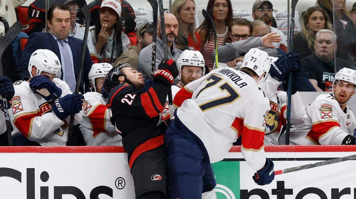 Panthers’ Niko Mikkola (77) checks Carolina’s Logan Stankoven (22) during the first period of the Carolina Hurricanes’ game against the Florida Panthers in Game 2 of the Eastern Conference Final at the Lenovo Center in Raleigh, N.C., Thursday, May 22, 2025.