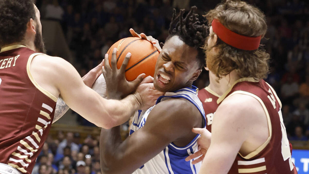 Duke’s Mark Mitchell (25) tries to get by Boston College’s Jaeden Zackery (3) and Mason Madsen (45) during the first half of Duke’s game against Boston College at Cameron Indoor Stadium in Durham, N.C., Saturday, Feb. 10, 2024.