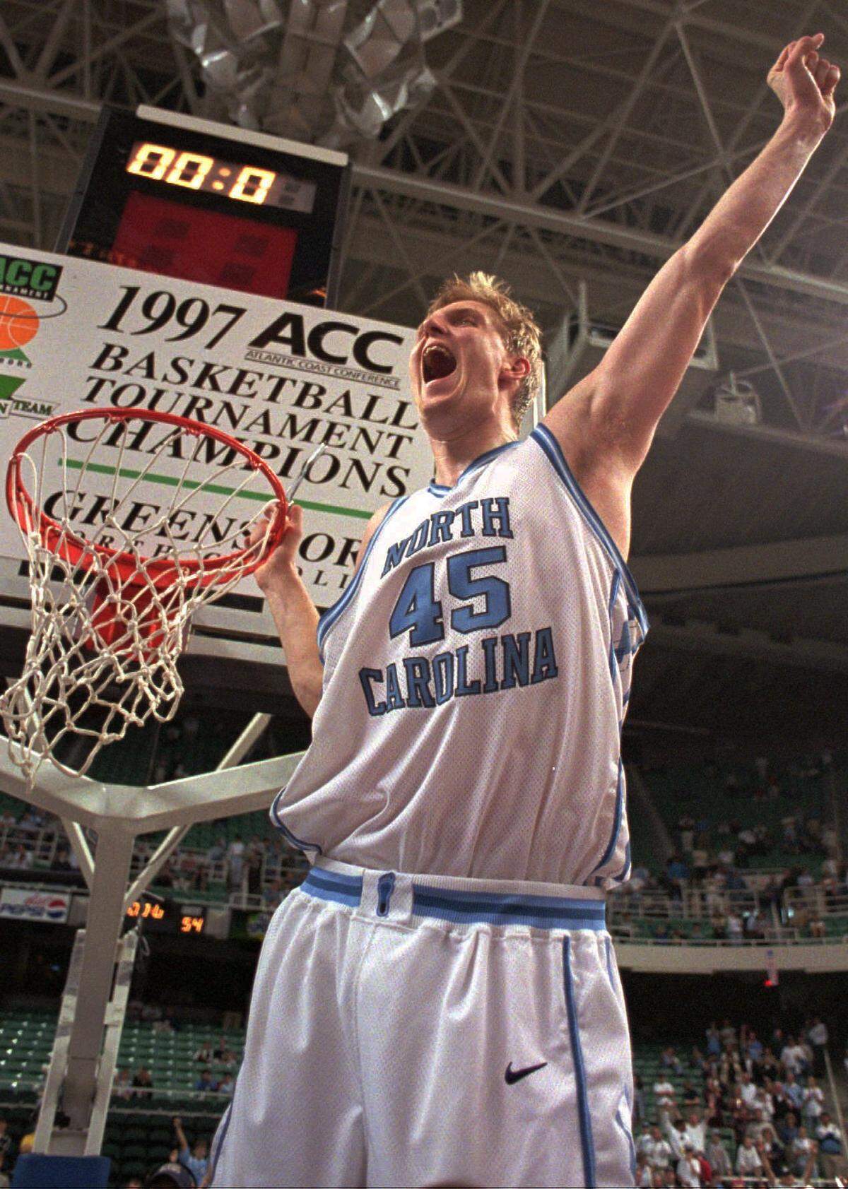 UNC’s Serge Zwikker shouts to the North Carolina fans during the post-game ceremony Sunday in Greensboro. Zwikker had 14 points in the Heels' 64-54 victory over the Wolfpack.   