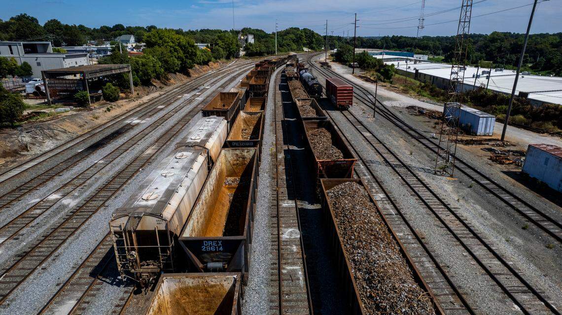 Hoppers and boxcars sit on the tracks in the Norfolk Southern rail yard near downtown Raleigh Wednesday, Sept. 14, 2022. A labor dispute between the nation’s freight railroads and two unions representing many of their employees could bring passenger trains to a halt in North Carolina.