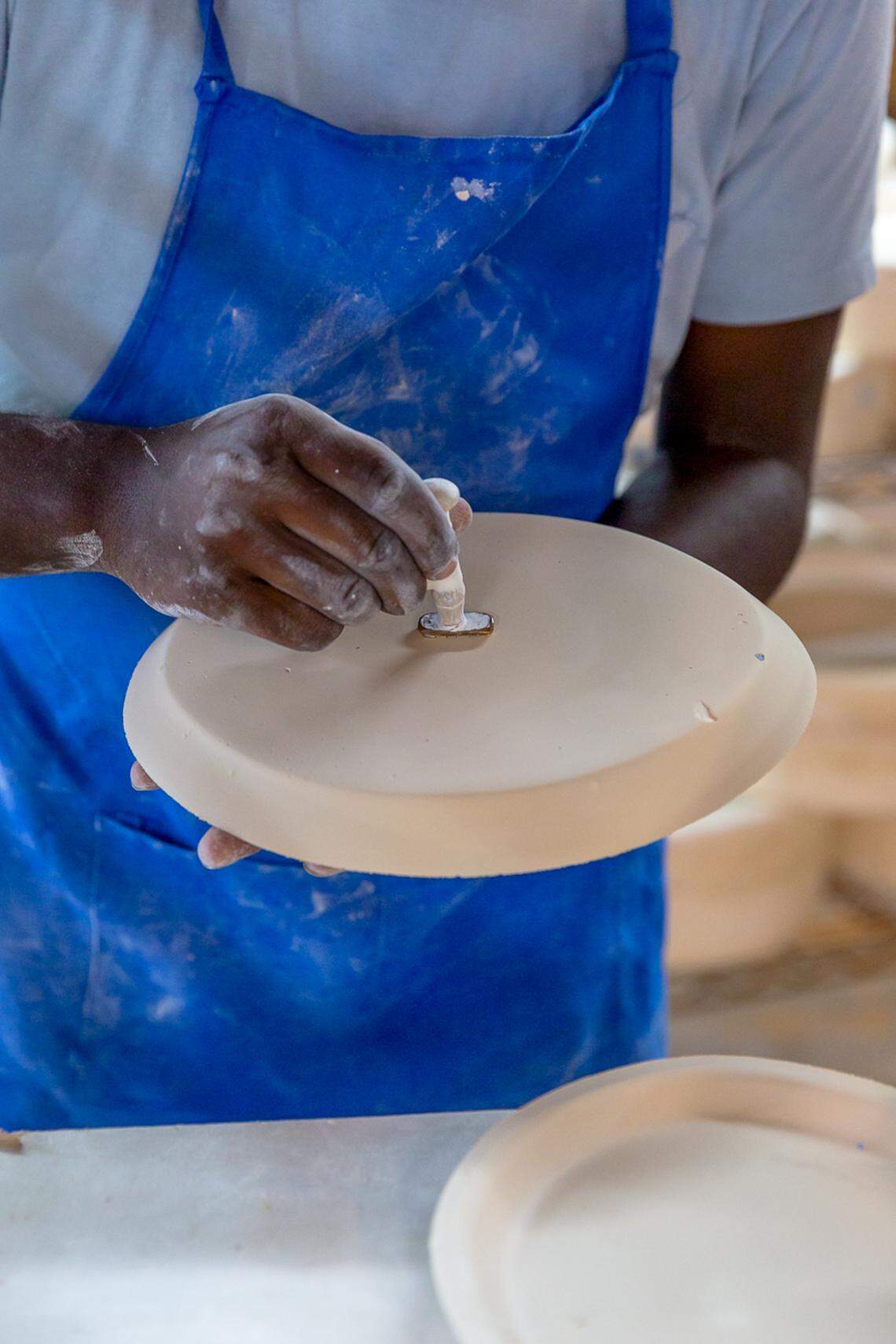 A Haand employee works on a ceramic piece in the Burlington, North Carolina, studio.