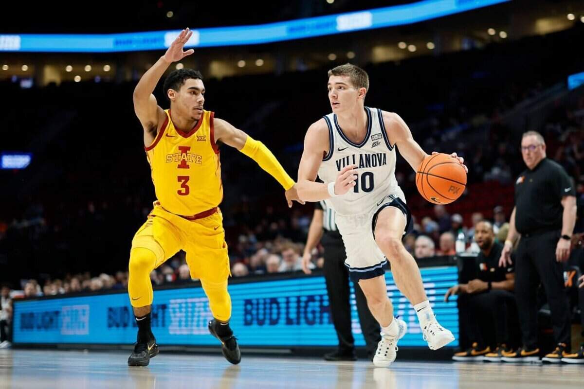 PORTLAND, OREGON - NOVEMBER 24: Angelo Brizzi #10 of the Villanova Wildcats dribbles the ball while defended by Tamin Lipsey #3 of the Iowa State Cyclones during the first half at Moda Center on November 24, 2022 in Portland, Oregon. (Photo by Soobum Im/Getty Images)