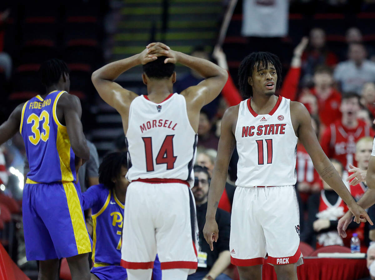 N.C. State’s Casey Morsell and Dennis Parker Jr. react to a foul called against the Wolfpack during the second half of the team’s 67-64 loss to Pittsburgh on Wednesday, Feb. 7, 2024, at PNC Arena in Raleigh, N.C.