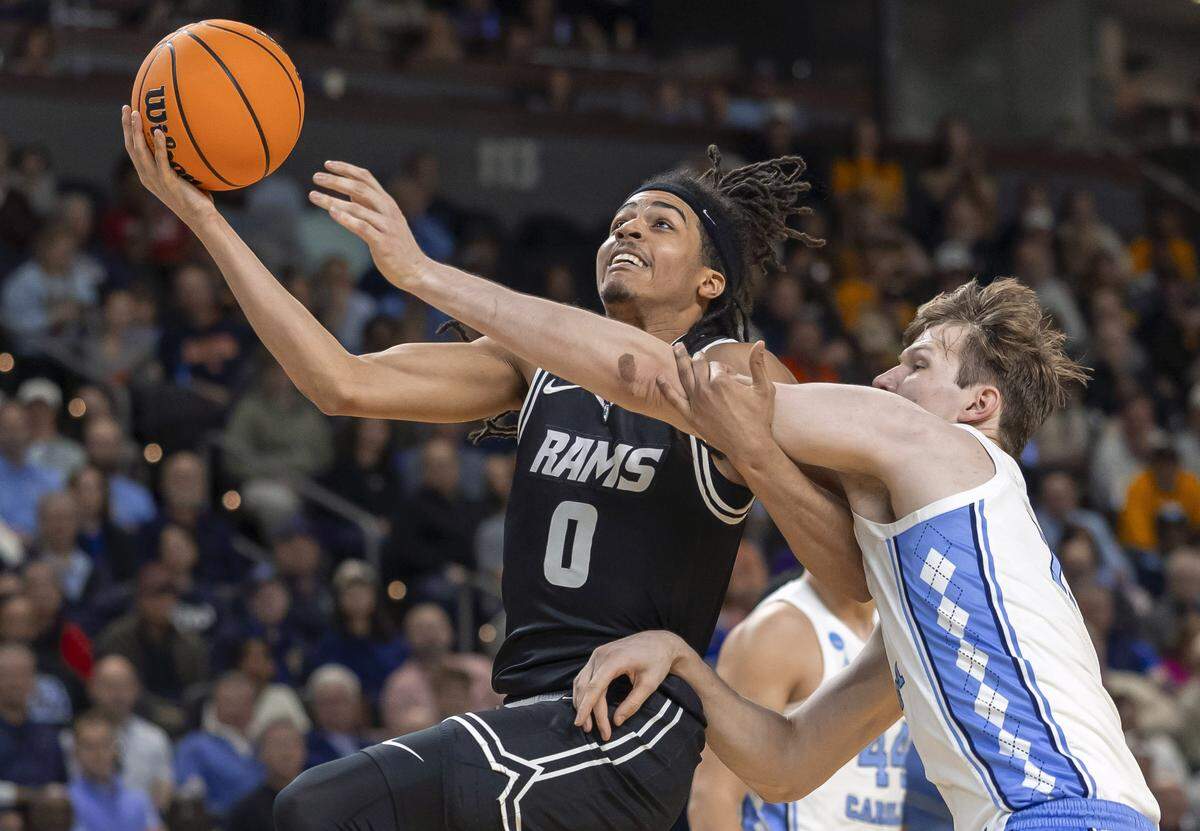 North Carolina center Henri Veesaar (13) defends VCU guard Brandon Jennings (0)  in the first half on Thursday, March 18, 2026, during the first round of the NCAA Tournament at Bon Secours Arena in Greenville, S.C.