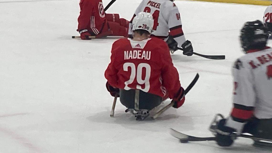 Forward Bradly Nadeau, the Carolina Hurricanes’ first-round draft pick in 2023, tries sled hockey Wednesday during the Canes’ prospects development camp.